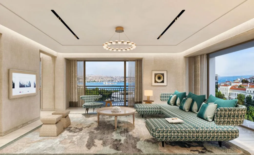 Dimly lit bar with herringbone timber floor, leather banquette seating, and textured coin-mosaic feature wall